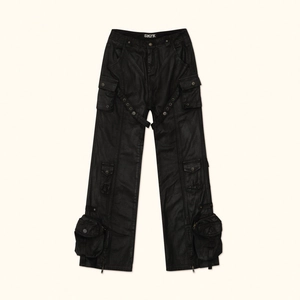 Black waxed cargo flare pants with multi-pockets and heavy fabric texture in street style