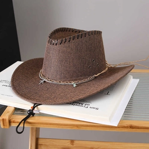Deep brown straw cowboy hat with star chain and adjustable windproof rope on magazine