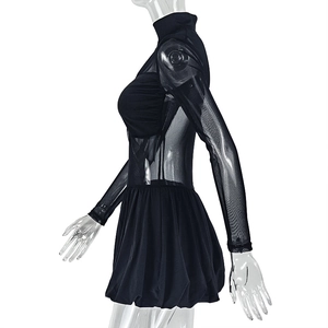 Detail of high neck black mesh long sleeve dress with pleated A-line skirt texture