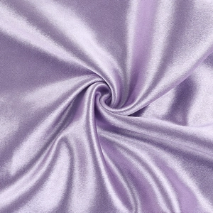 Detailed view of luxury purple satin fabric with elegant drapes and silky smooth texture