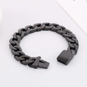 Close-up of black Cuban link bracelet with a matte industrial metal finish and sturdy clasp