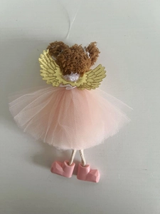 Detail of angel bear ornament featuring golden wings and pink mesh tulle dress