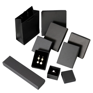 Set of black matte cardboard jewelry boxes and matching gift bags for rings and necklaces