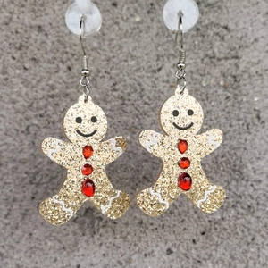 Boucles d'oreilles bonhomme de pain d'épices en acrylique pailleté doré et gemmes rouges