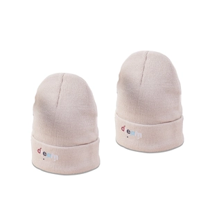 Pink knit beanie hat with Dream embroidery and star details for winter warmth