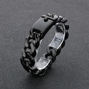 Macro shot of thick black stainless steel Cuban link bracelet with a rectangle clasp