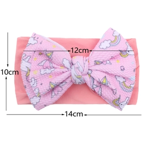 Pink waffle texture baby turban headband with unicorn print and 12cm bow size detail