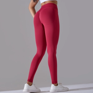 Close-up of deep red seamless yoga leggings with high waist and peach butt lifting design