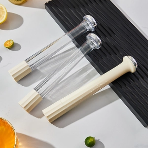 Three professional cocktail muddlers for lemon tea on a white marble surface backdrop