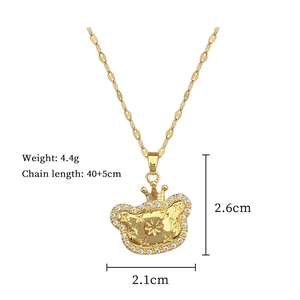 Detail of gold crown cat pendant with dimensions 2.1cm x 2.6cm and 40+5cm chain