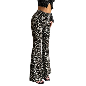 Women's high waist zebra print flare pants in brown and black with rhinestone details