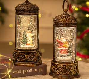 Close-up of vintage bronze Christmas lantern with snowman and Santa inside falling snow