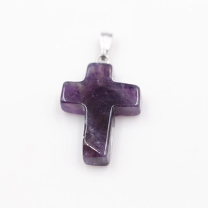 Natural purple amethyst cross pendant with silver bail on clean white background