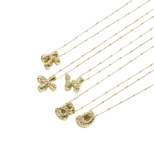 Golden chunky letter pendant necklace with sparkling zircons on fine curb chain