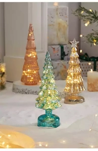 Lighted glass Christmas trees with LED lights in teal, amber, and pink for holiday decor