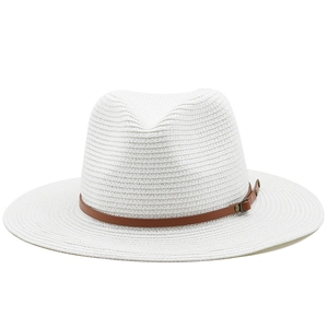 Close-up of white straw fedora hat featuring a brown faux leather belt and metal buckle