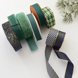 Assorted Christmas ribbons with gold stamping and glitter for DIY gift wrapping