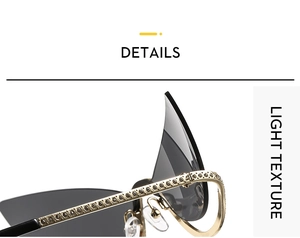 Macro detail of gold metal frame sunglasses with sparkling rhinestones and dark lenses