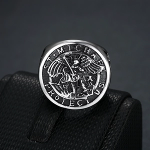 Macro shot of Archangel St. Michael relief on vintage stainless steel ring for men