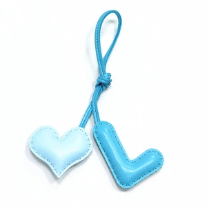 Handmade blue leather heart and letter L bag charm with premium stitched texture
