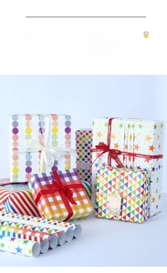 Close-up of assorted colorful gift wrapping paper with stars, dots, and ribbons on boxes