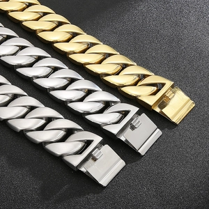 Detailed view of heavy Cuban link chains in gold, bright silver, and matte silver finishes