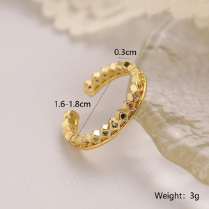 Macro shot of gold-plated copper ring detail with colorful inlaid zircon stones