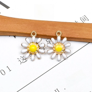 DIY daisy charms with white petals and yellow center for handmade jewelry making