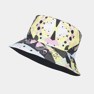 Detail view of double-sided bucket hat with colorful 3D geometric patterns and black lining