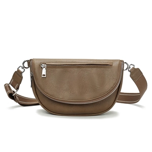 Brown faux leather crescent crossbody bag with wide adjustable strap and silver zippers