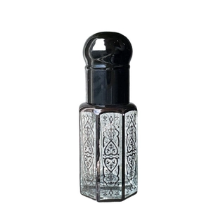 Laser coated crystal perfume oil bottle with black octagonal cap and hexagonal glass body