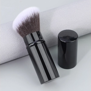Portable retractable flat head foundation brush with dual-tone synthetic bristles and lid