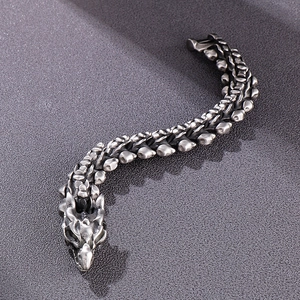 Bracciale da uomo stile punk retrò con design a osso di drago in argento antico
