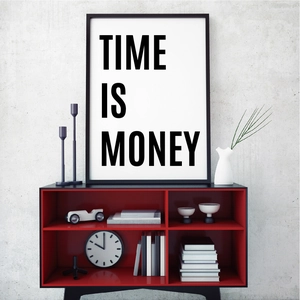 Minimalist black and white Time Is Money poster in a black frame on a stylish red cabinet