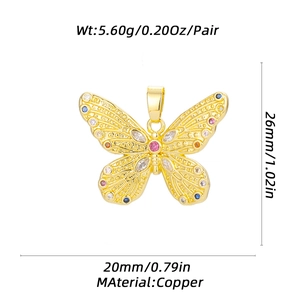 Detail view of gold butterfly pendant charm made of copper with size and weight metrics