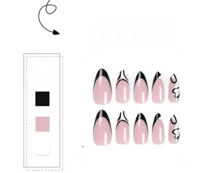 Detailed view of almond press-on nails with black French tips and heart hand-painted designs