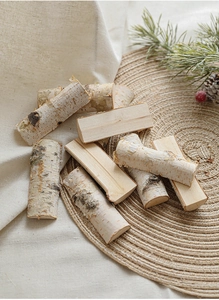 Close-up of natural birch wood blocks with bark for Christmas DIY crafts and decor