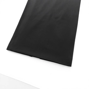 Close-up of elegant black fabric texture for women strapless dress against white background