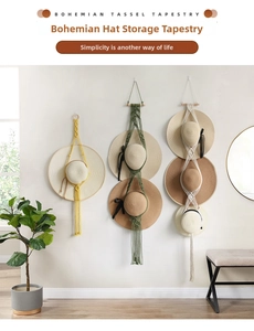 Detail of bohemian macrame hat organizer with hand-woven cotton ropes and wooden rods