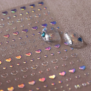 Holographic heart nail stickers featuring solid and hollow designs with laser finish