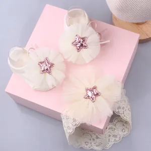 Detail of infant gift set featuring lace headband and knit socks with glitter star tulle