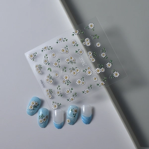 Detail of 5D camomile floral nail stickers showing 3D embossed texture and blue nail art