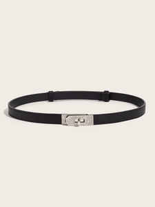 Detail of Saffiano leather belt with silver buckle and rhinestones