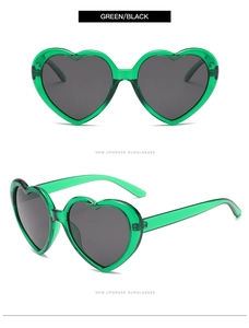 Detail view of heart-shaped sunglasses in vibrant transparent green frames with black lenses
