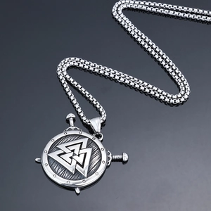 Vintage Viking shield pendant with dual swords and Valknut symbol on black mirror base