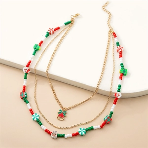 Close-up of multilayer Christmas necklace with colorful beads and festive charms