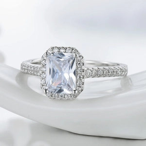 Sparkling S925 silver halo ring with a large rectangular zircon and paved side stones