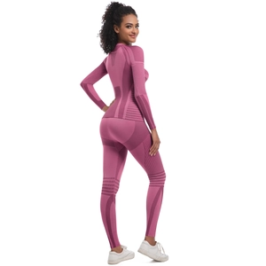 Close-up of high-elastic seamless knit fabric with breathable mesh textures on a pink yoga set