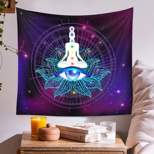 Detail of meditation tapestry with galaxy background, colorful chakras and lotus line art