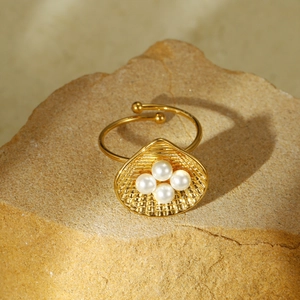 French vintage shell-shaped stainless steel ring with white pearls on a natural stone